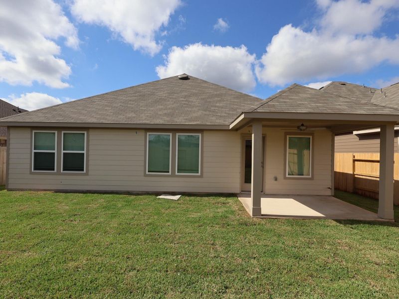 Exterior details and patio area of a home in Pinewood at Grand Texas, New Caney (Image 12).