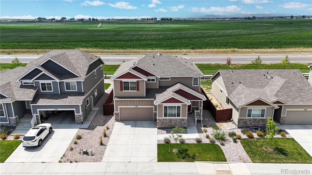 Front exterior of a new home in Ravina, Windsor, CO, highlighting curb appeal (Image 22). Front exterior of a new home in Ravina, Windsor, CO, highlighting curb appeal (Image 22).