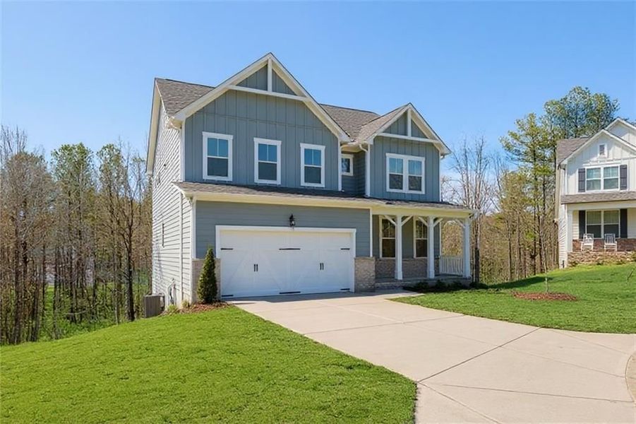Front exterior of a new home in Riverwood, Dallas, GA, highlighting curb appeal (Image 3).