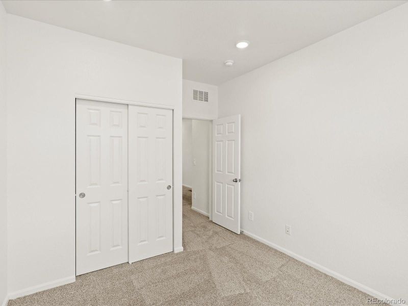 Spacious, unfurnished interior of a new home in Ridgeline Vista: The Flora Collection, Brighton (Image 23).