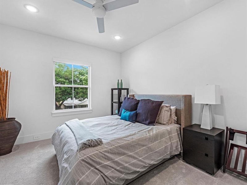 A view of one of the spacious secondary bedrooms.