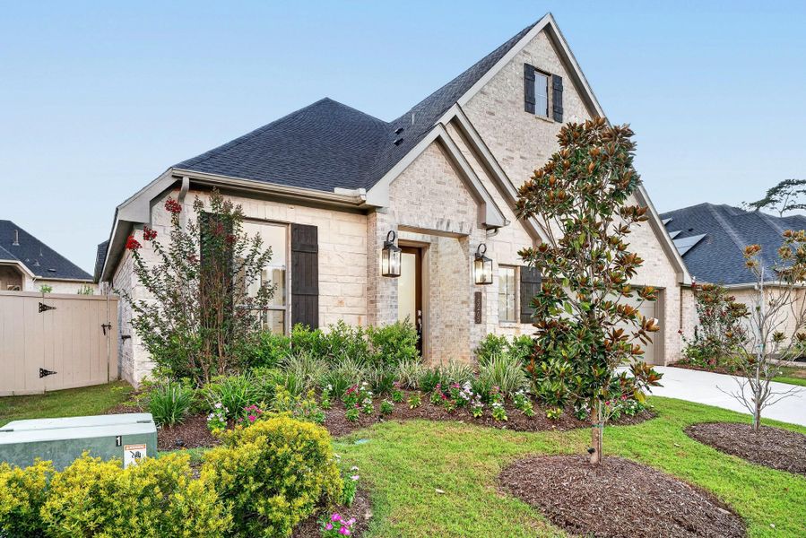Front exterior of a new home in Audubon 60′, Magnolia, TX, highlighting curb appeal (Image 2). Front exterior of a new home in Audubon 60′, Magnolia, TX, highlighting curb appeal (Image 2).