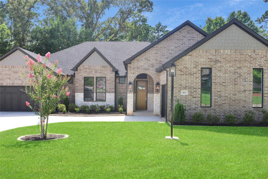 Front exterior of a new home in Bentwater, Montgomery, TX, highlighting curb appeal (Image 1). Front exterior of a new home in Bentwater, Montgomery, TX, highlighting curb appeal (Image 1).