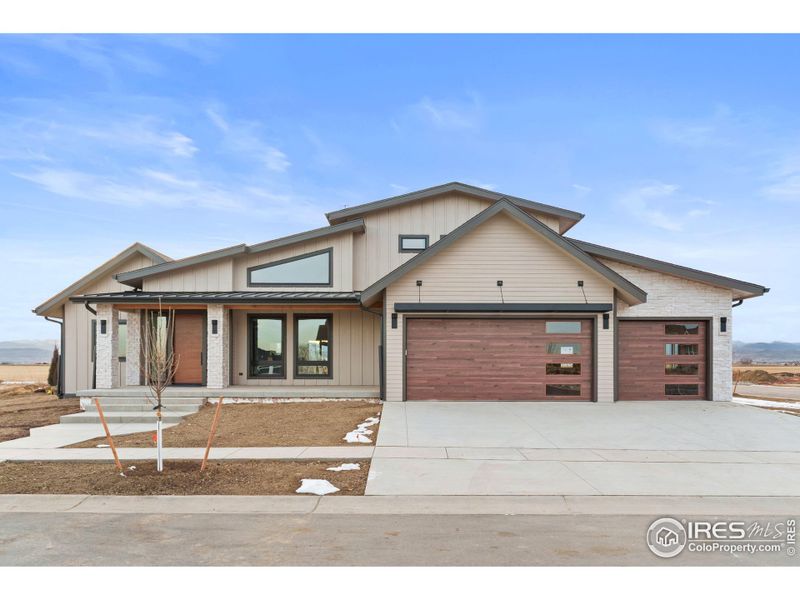Front exterior of a new home in , Berthoud, CO, highlighting curb appeal (Image 15).