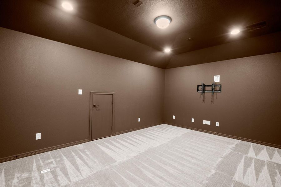 Double doors off the game room open into this awesome media room, already wired for 7.1 surround sound so you can take your movie nights to the next level. Double doors off the game room open into this awesome media room, already wired for 7.1 surround sound so you can take your movie nights to the next level.