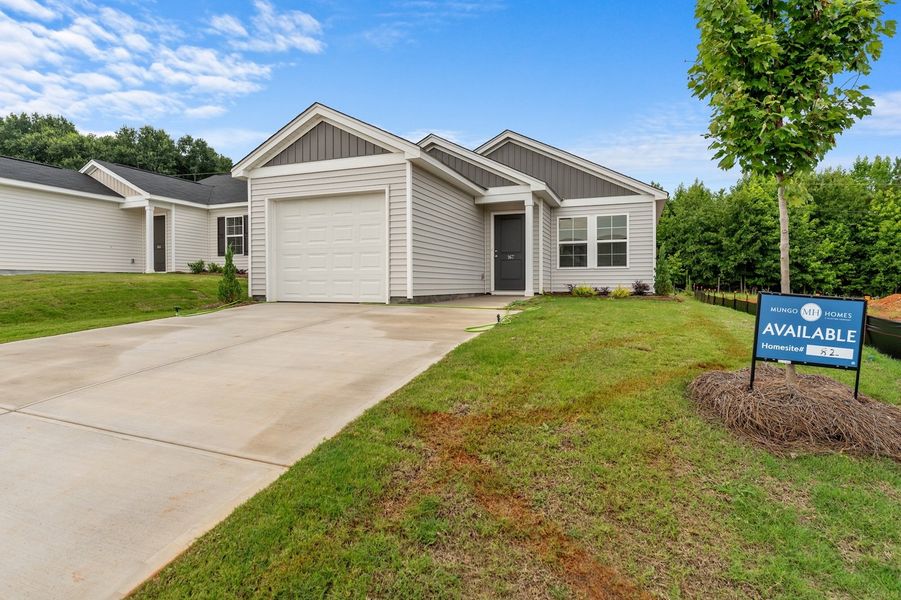 Front exterior of a new home in Evergreen, Spartanburg, SC, highlighting curb appeal (Image 2). Front exterior of a new home in Evergreen, Spartanburg, SC, highlighting curb appeal (Image 2).