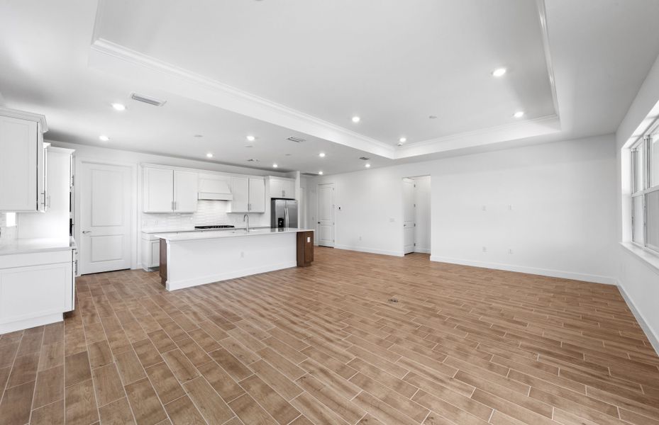 Spacious gathering room featuring a drop tray ceiling