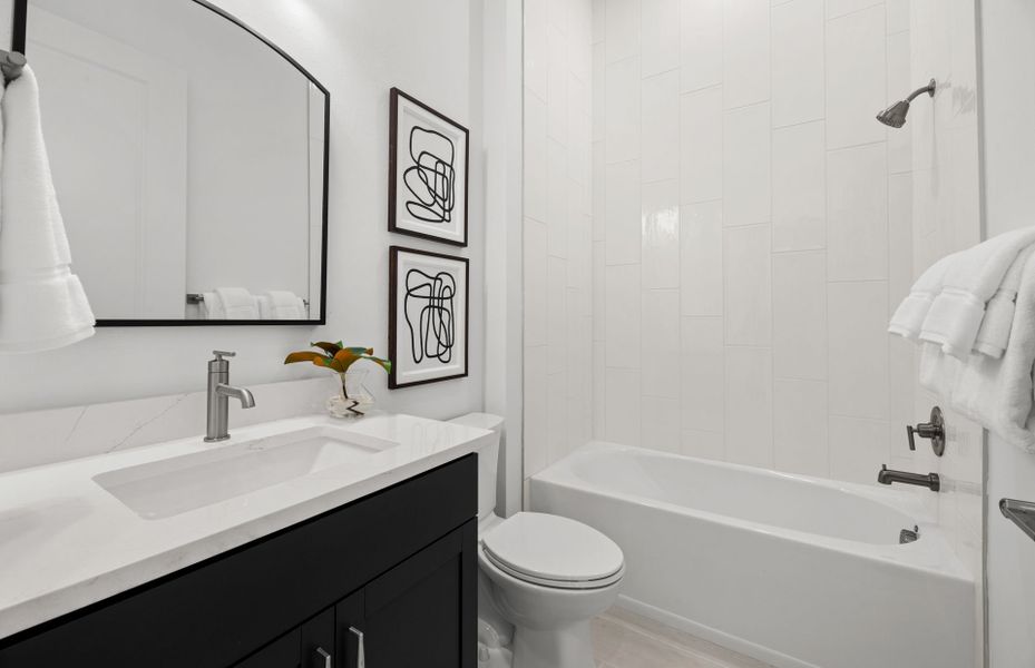 Representative furnished interior of a home built from the Prosperity by DiVosta in BeachWalk by Manasota Key, Englewood (Image 11).