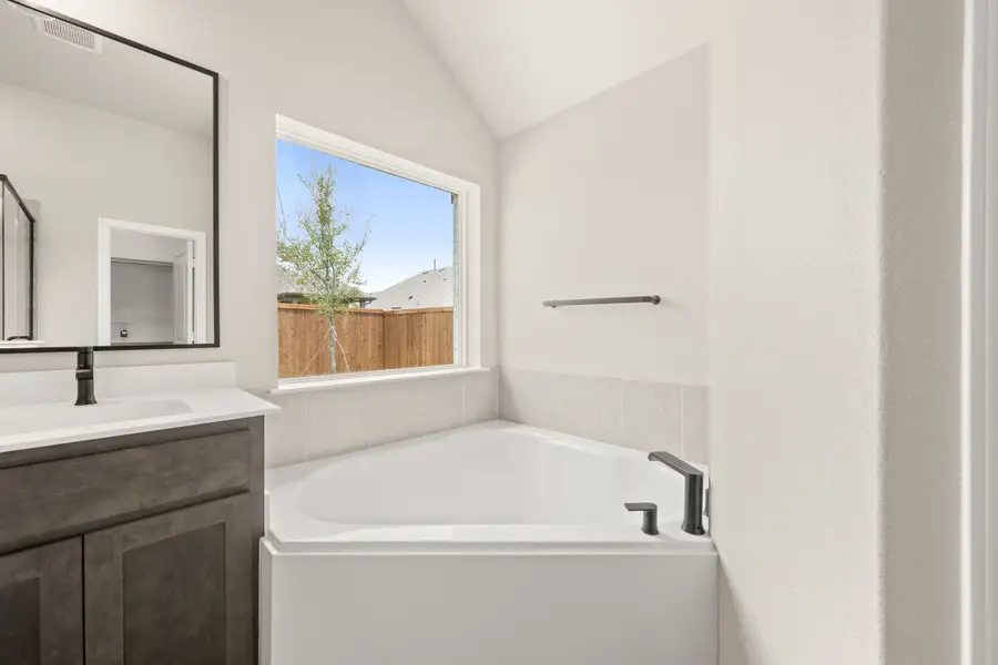 Furnished interior view inside a new home in Hunters Ridge, Crowley (Image 10).