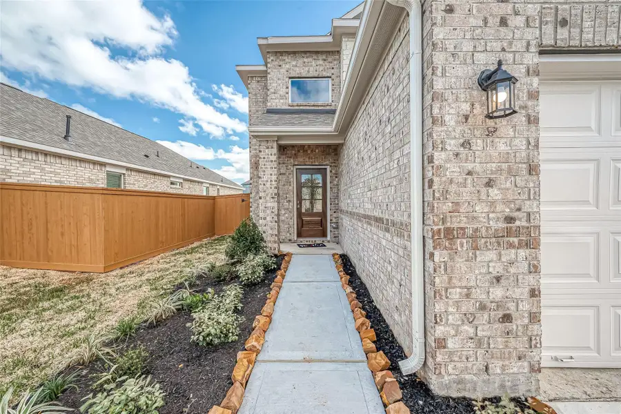 Exterior details and patio area of a home in Mill Creek Trails, Magnolia (Image 2).