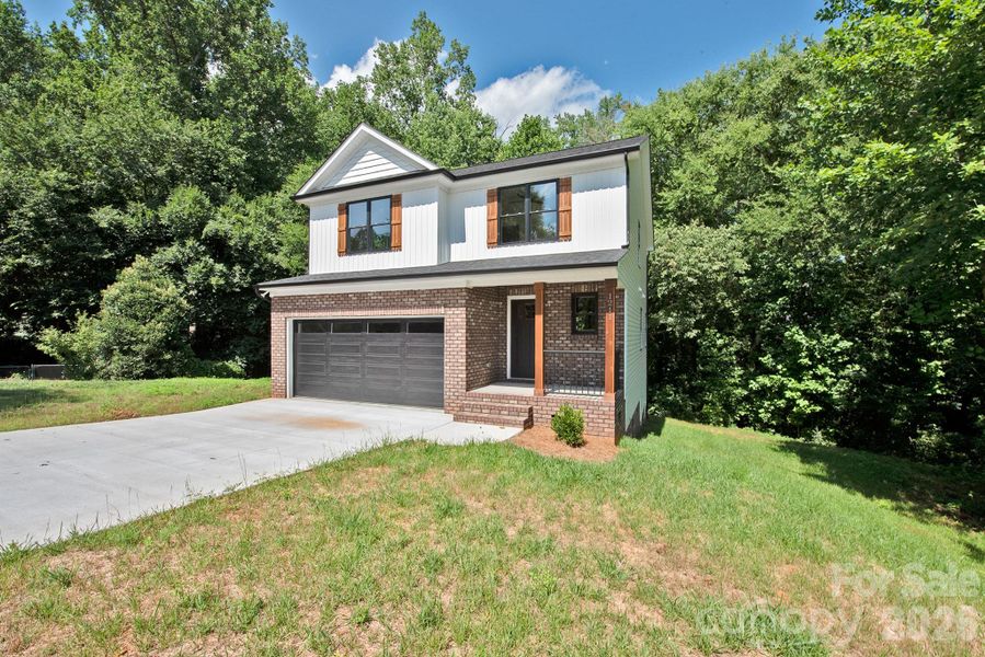 Front exterior of a new home in , Kannapolis, NC, highlighting curb appeal (Image 22). Front exterior of a new home in , Kannapolis, NC, highlighting curb appeal (Image 22).