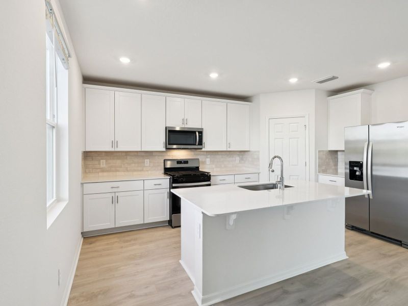 Furnished interior view inside a new home in Hamilton Bluff - Signature Series, Haines City (Image 3).