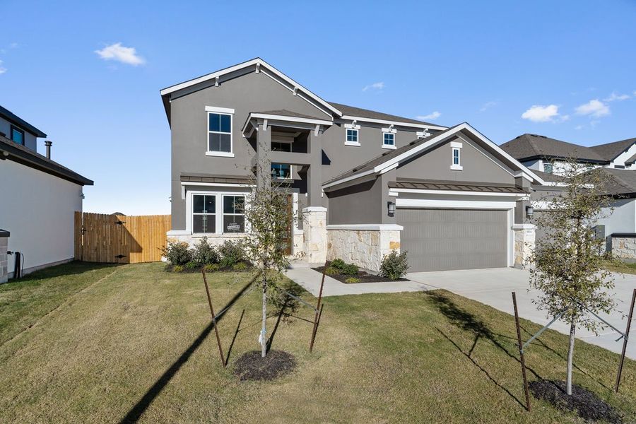 Front exterior of a new home in Enclave at Cele, Pflugerville, TX, highlighting curb appeal (Image 2). Front exterior of a new home in Enclave at Cele, Pflugerville, TX, highlighting curb appeal (Image 2).
