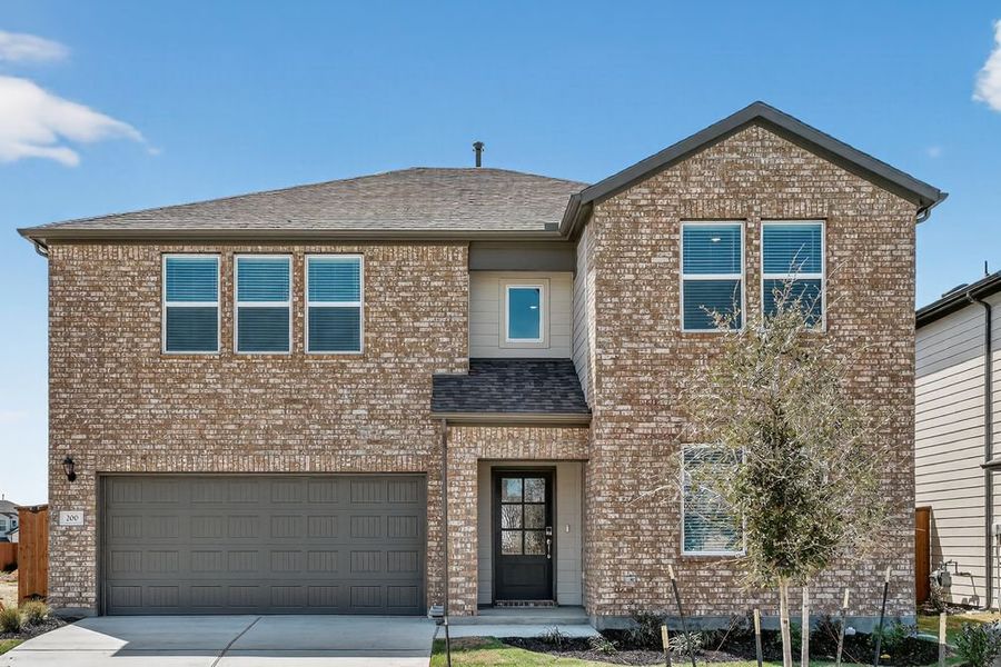 Representative exterior photo of a completed home built from the Wren by Taylor Morrison in Longview, Del Valle, TX (Image 19).