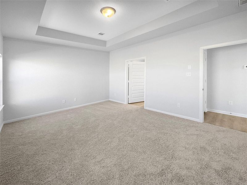The Waring III-Primary Suite, Tray Ceiling not included. Under construction, options, upgrades and colors will vary.