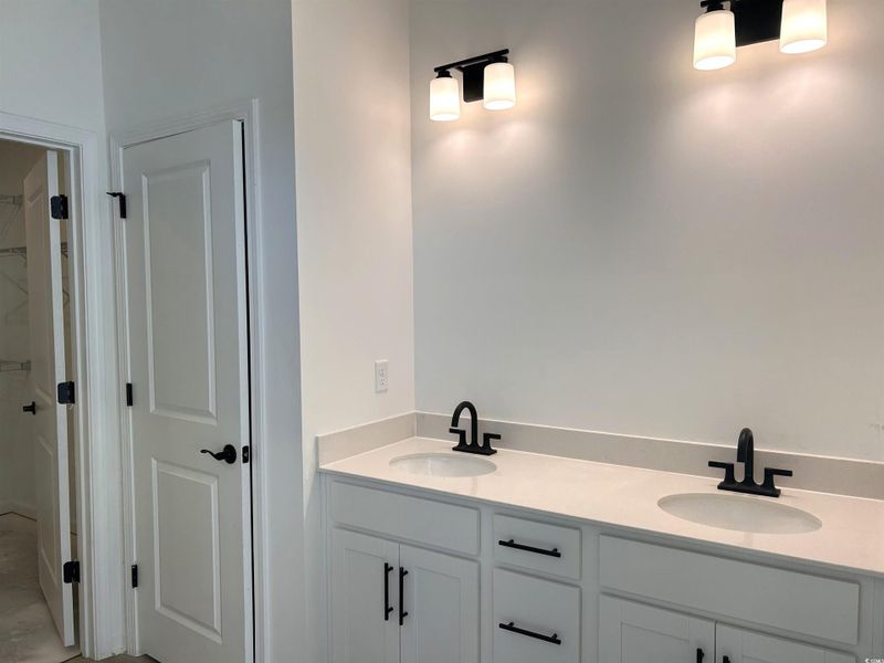 Bathroom featuring double vanity