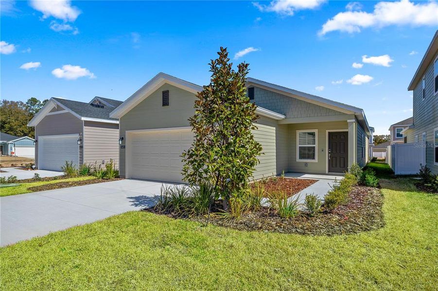 Front exterior of a new home in Pioneer Ranch, Ocala, FL, highlighting curb appeal (Image 2).