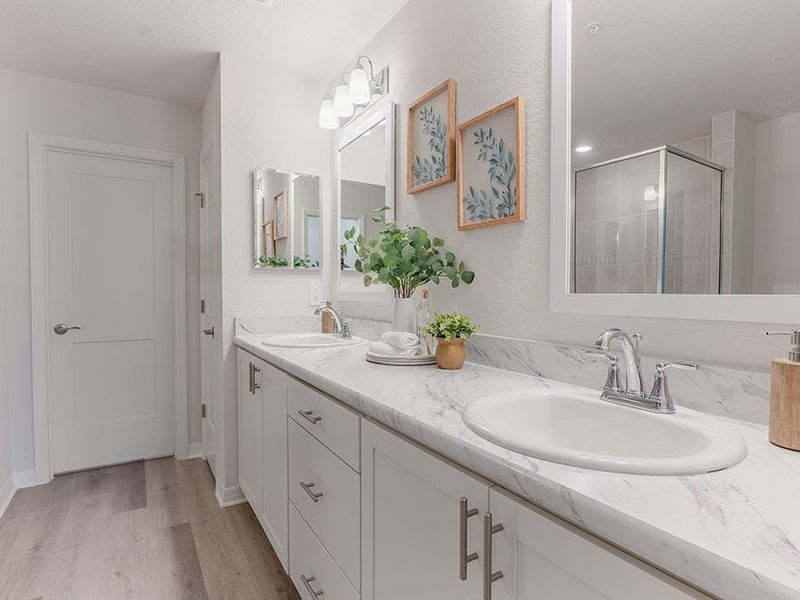 Your suite is complete with an en-suite bath with a large tiled shower - Aspen townhome by Highland Homes Your suite is complete with an en-suite bath with a large tiled shower - Aspen townhome by Highland Homes