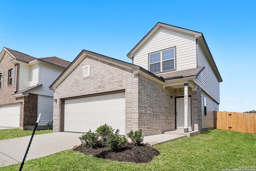 Front exterior of a new home in Blue Ridge Ranch, San Antonio, TX, highlighting curb appeal (Image 14). Front exterior of a new home in Blue Ridge Ranch, San Antonio, TX, highlighting curb appeal (Image 14).