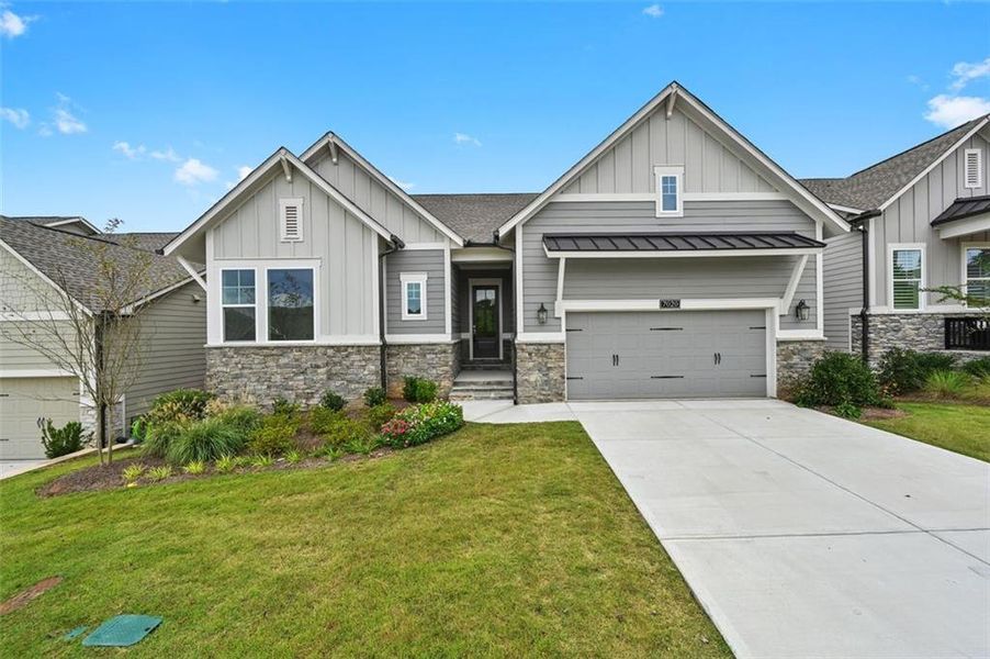 Front exterior of a new home in , Flowery Branch, GA, highlighting curb appeal (Image 1).