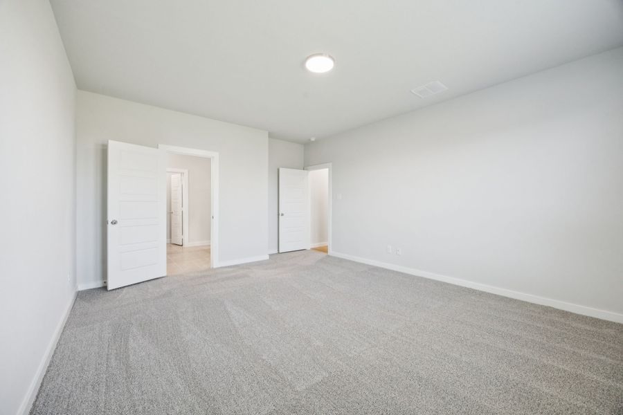 Primary Suite in the Masters home plan by Trophy Signature Homes – REPRESENTATIVE PHOTO Primary Suite in the Masters home plan by Trophy Signature Homes – REPRESENTATIVE PHOTO