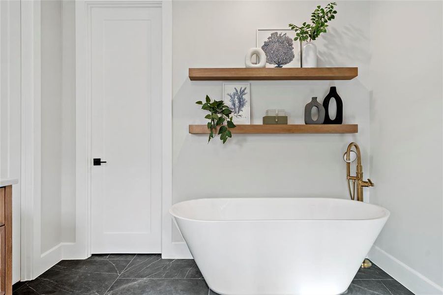Primary bathtub with accent shelving