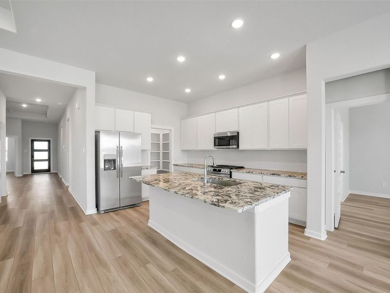Furnished interior view inside a new home in Sunterra, Katy (Image 8).