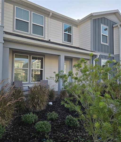 Front exterior of a new home in Isles of Lake Nona, Orlando, FL, highlighting curb appeal (Image 16).