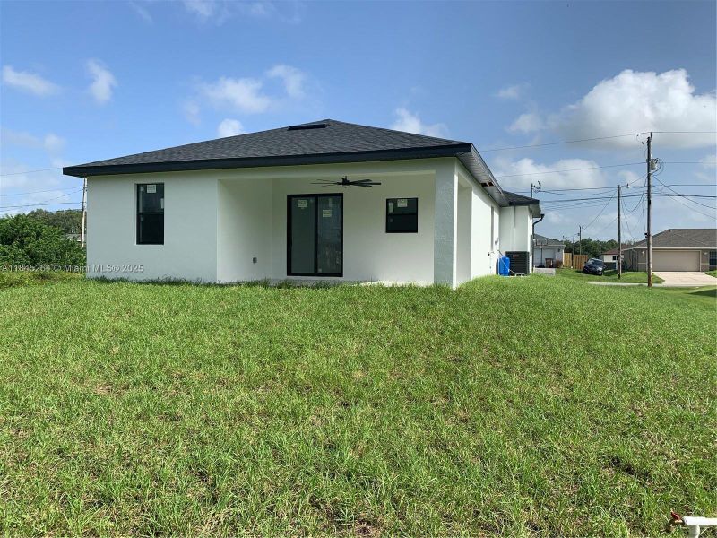 Front exterior of a new home in , Lehigh Acres, FL, highlighting curb appeal (Image 2).