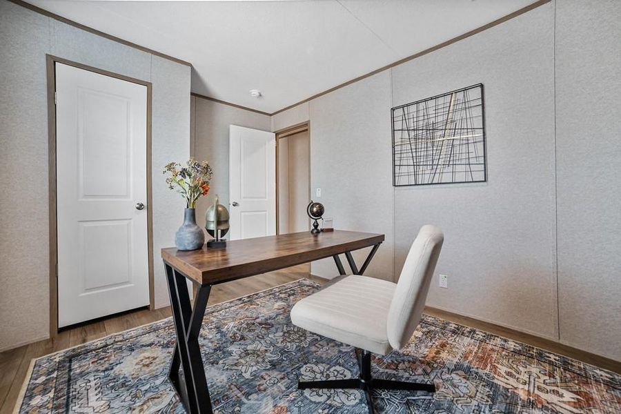 Office area with crown molding and wood finished floors Office area with crown molding and wood finished floors