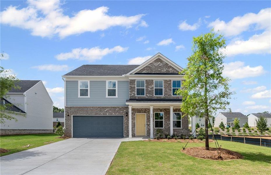 Front exterior of a new home in Hawthorne Ridge, McDonough, GA, highlighting curb appeal (Image 1).