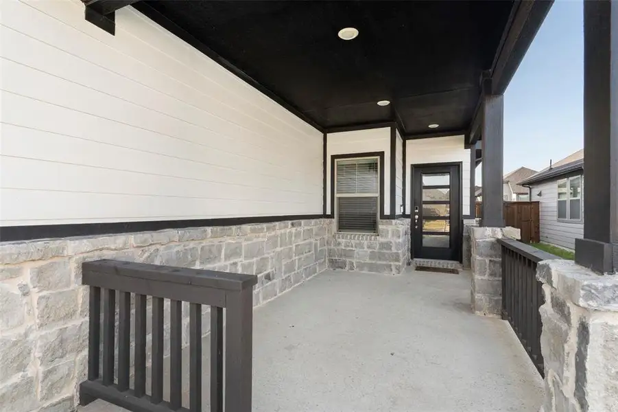 Exterior details and patio area of a home in Lakehaven - Spring Series, Farmersville (Image 3).