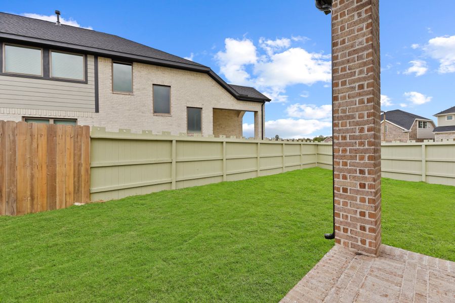 Front exterior of a new home in Wood Leaf Reserve, Tomball, TX, highlighting curb appeal (Image 20).