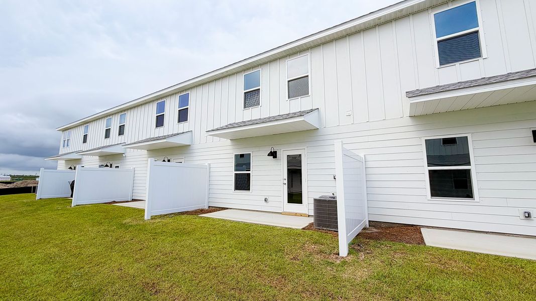 Exterior details and patio area of a home in Salt Creek Townhomes at Mexico Beach, Mexico Beach (Image 20).