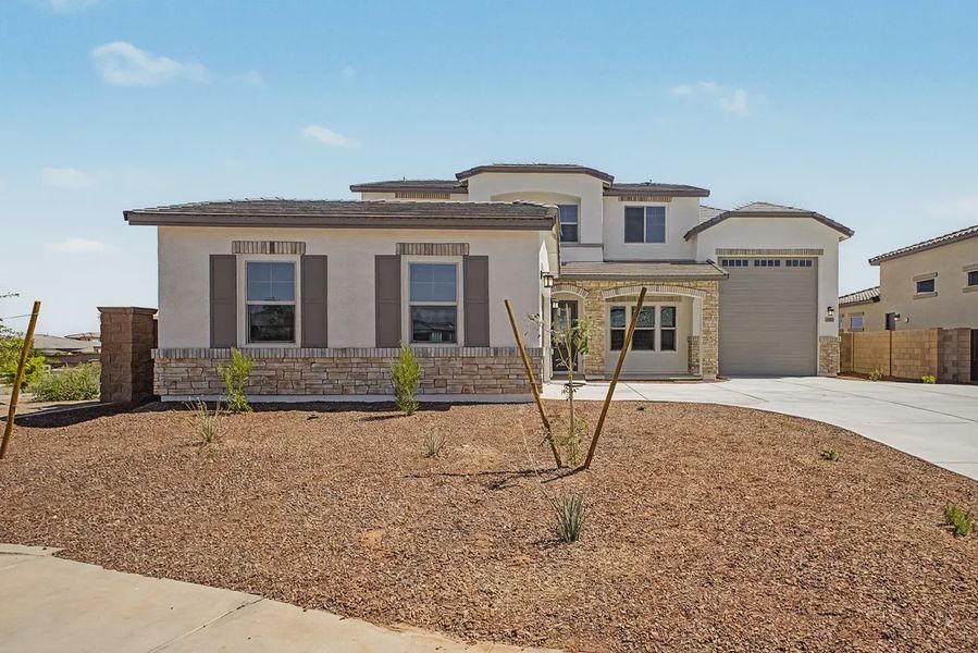Front exterior of a new home in Valencia at Granite Vista, Waddell, AZ, highlighting curb appeal (Image 21). Front exterior of a new home in Valencia at Granite Vista, Waddell, AZ, highlighting curb appeal (Image 21).