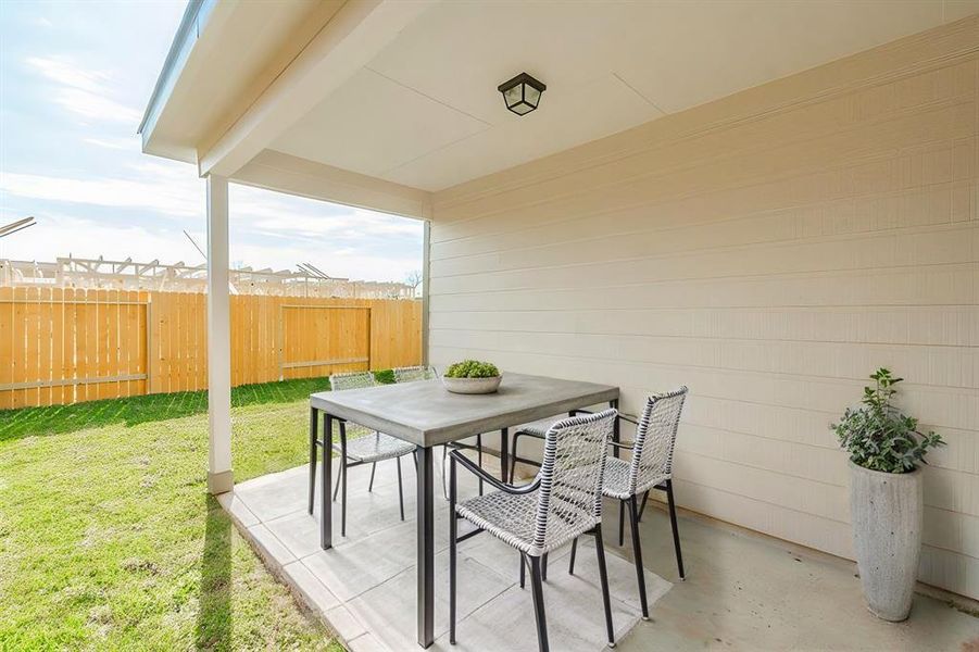 Relax and entertain in the shade on this covered patio. Overlooking a fenced backyard, this space is perfect for outdoor dining, morning coffee, or weekend BBQs. With its easy access to the living areas, this patio enhances your home’s indoor-outdoor lifestyle.