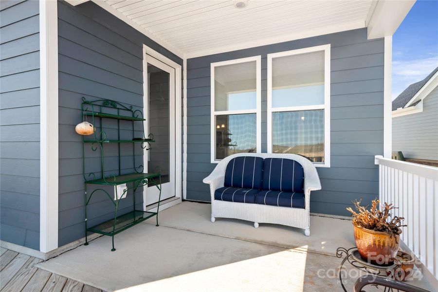 At the end of the day, you will enjoy time spent with family and friends or just relaxing alone with a good book and your favorite beverage on this covered rear porch - overlooking a community pond.