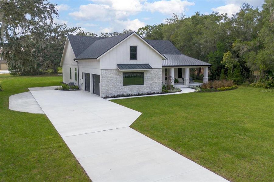 Front exterior of a new home in , Deland, FL, highlighting curb appeal (Image 32).