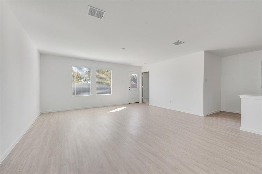 Spare room with light hardwood / wood-style floors