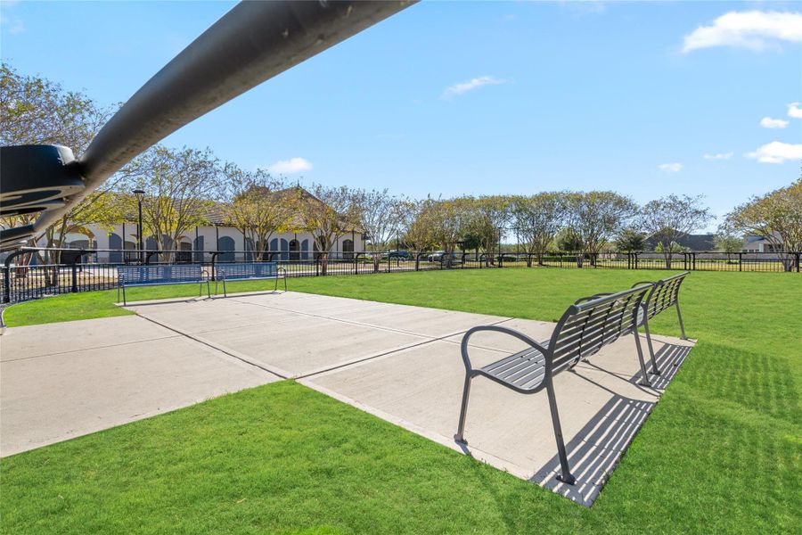 Open lawn area and shaded seating near the amenities, great for picnics and outdoor play.