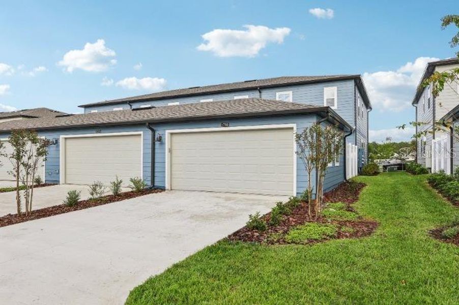 Exterior details and patio area of a home in Northlake Townhomes, Winter Garden (Image 21). Exterior details and patio area of a home in Northlake Townhomes, Winter Garden (Image 21).