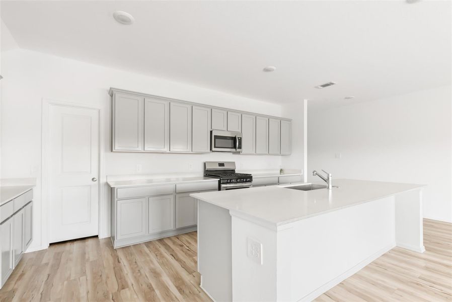 Pull up some barstools for kids to hang out for snacks and homework. That door leads to the walk in pantry. This island is very spacious and can provide a ton of storage. Pull up some barstools for kids to hang out for snacks and homework. That door leads to the walk in pantry. This island is very spacious and can provide a ton of storage.