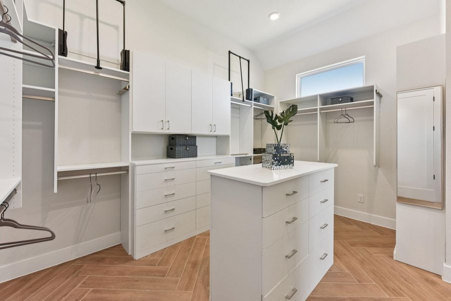 Walk in closet featuring parquet flooring