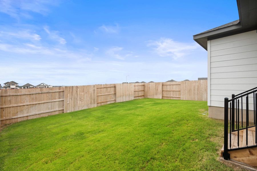 Exterior details and patio area of a home in Lariat, Liberty Hill (Image 25).