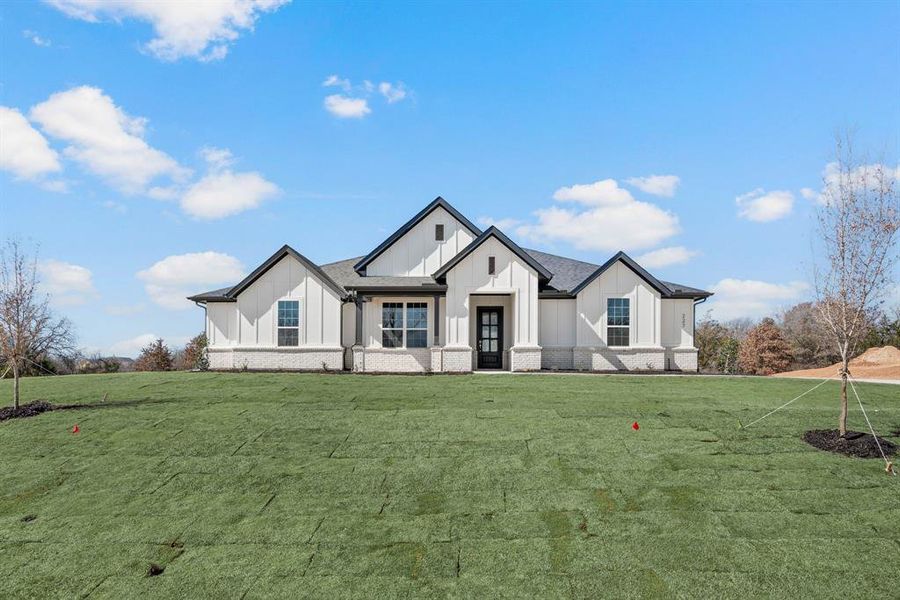 Front exterior of a new home in Saddleback Estates, Boyd, TX, highlighting curb appeal (Image 1). Front exterior of a new home in Saddleback Estates, Boyd, TX, highlighting curb appeal (Image 1).