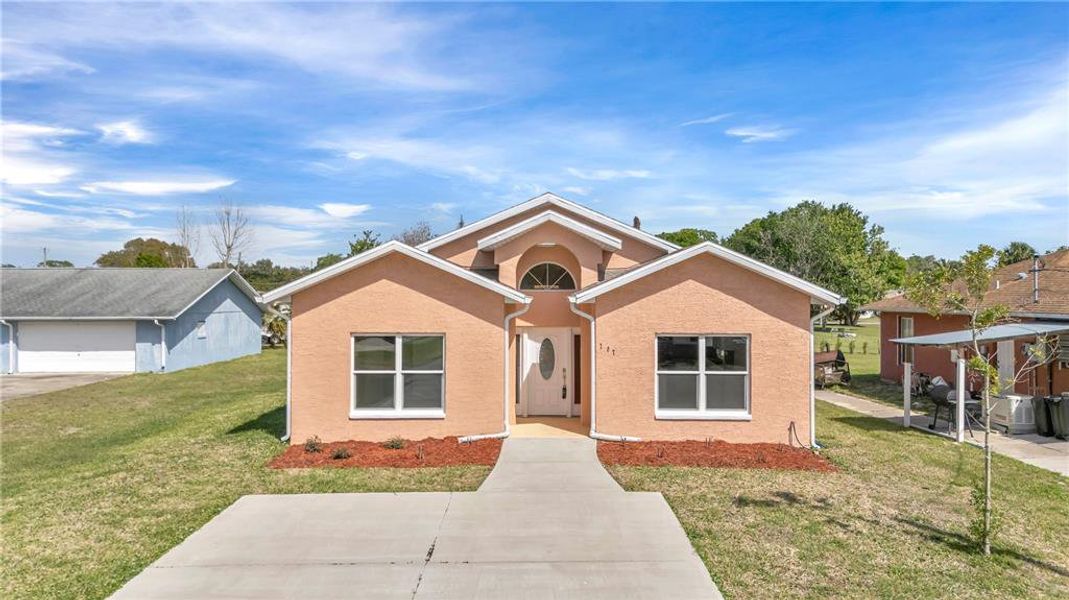 Front exterior of a new home in , New Smyrna Beach, FL, highlighting curb appeal (Image 20). Front exterior of a new home in , New Smyrna Beach, FL, highlighting curb appeal (Image 20).