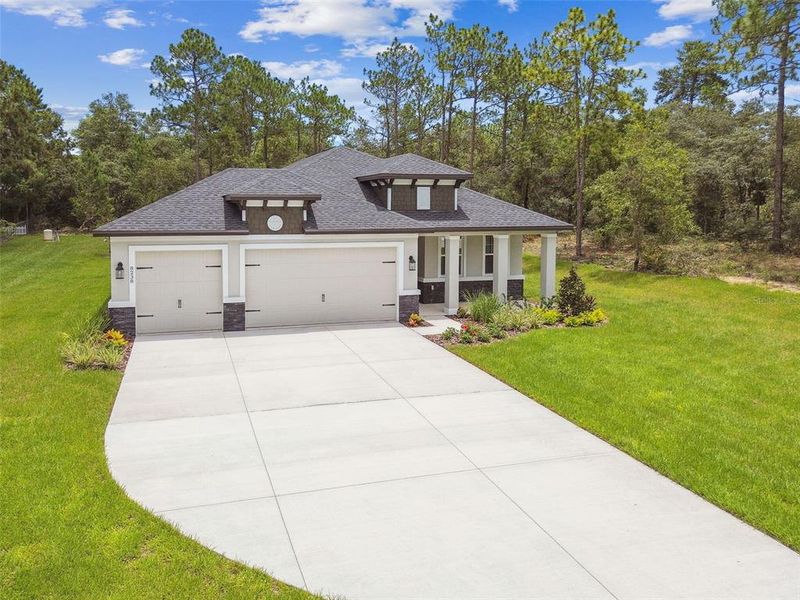Front exterior of a new home in Hidden Ridge, New Port Richey, FL, highlighting curb appeal (Image 1).