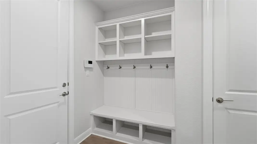 Mudroom featuring dark wood-type flooring Mudroom featuring dark wood-type flooring