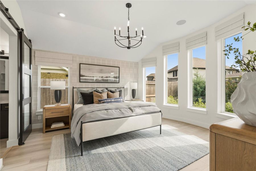 Primary bedroom with big windows and high ceilings Primary bedroom with big windows and high ceilings