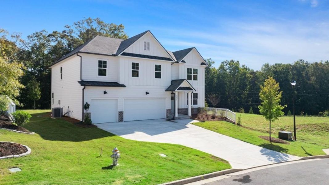 Front exterior of a new home in Falcon Landing, Gainesville, GA, highlighting curb appeal (Image 2).